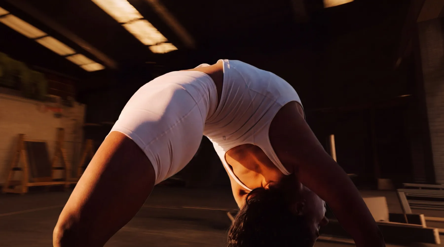 Athlete mid-movement, arching backward