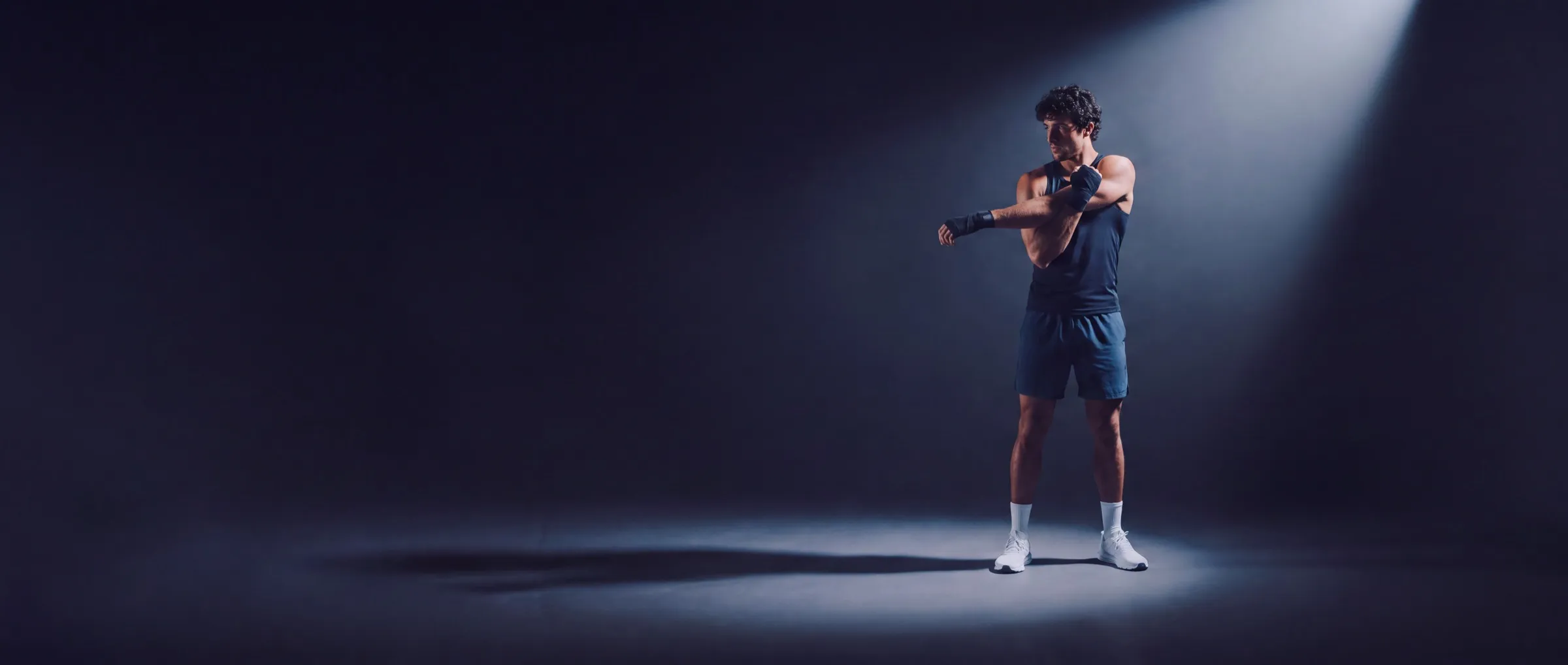 Athlete training under a spotlight