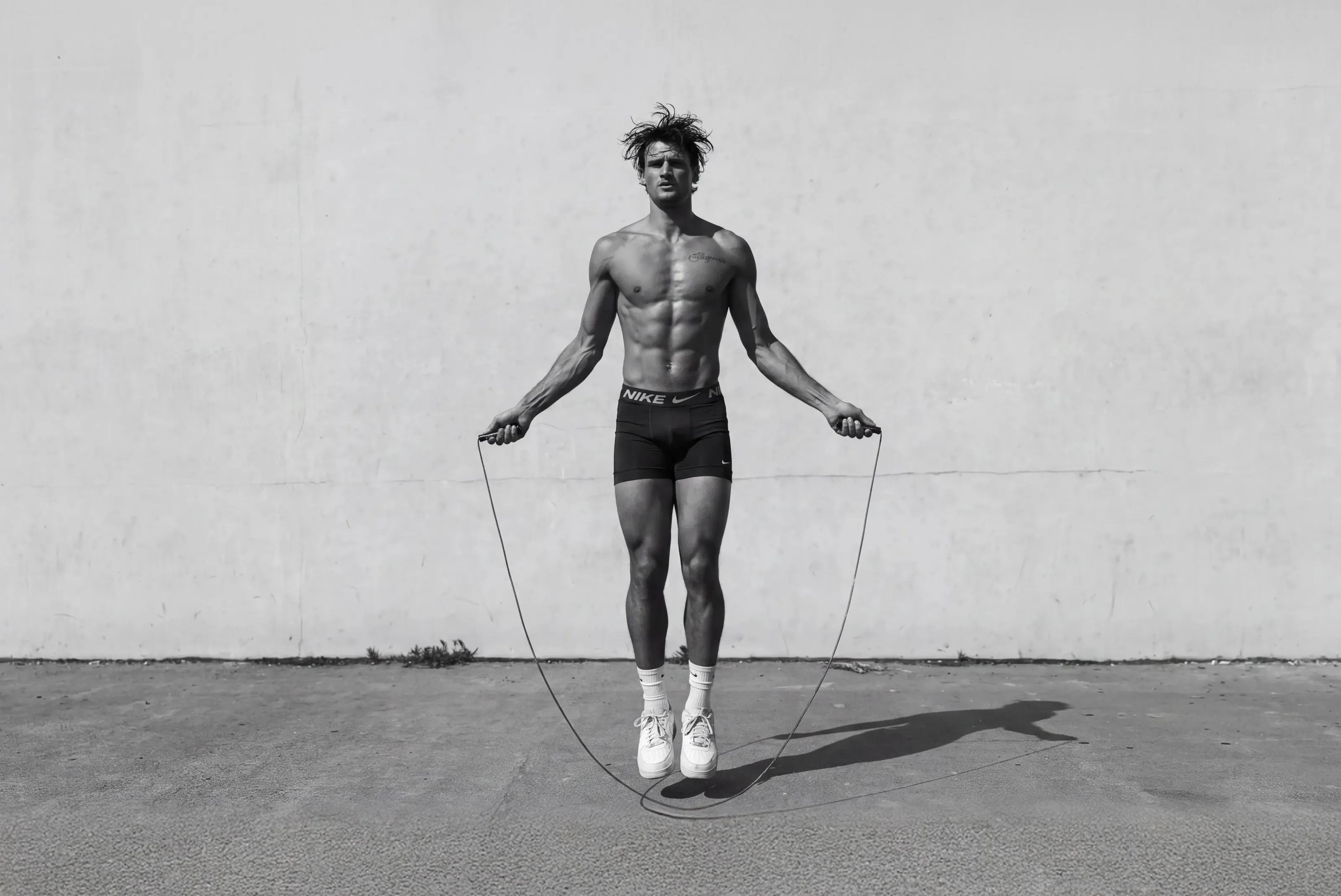 Athlete jumping rope in a studio